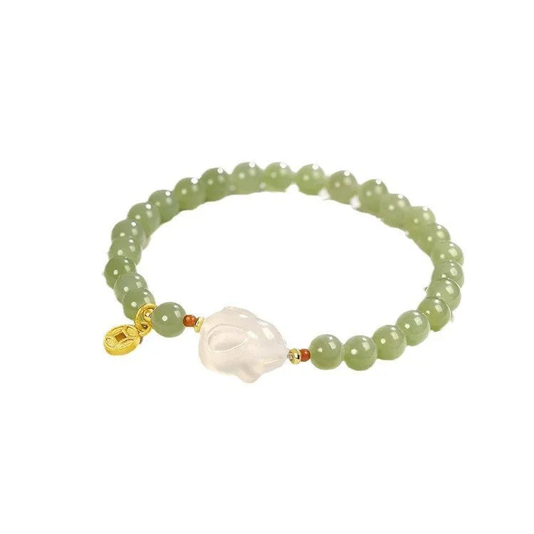 Handmade women's Hetian Jade Rabbit bracelet with glass rabbit charms in a gift box.