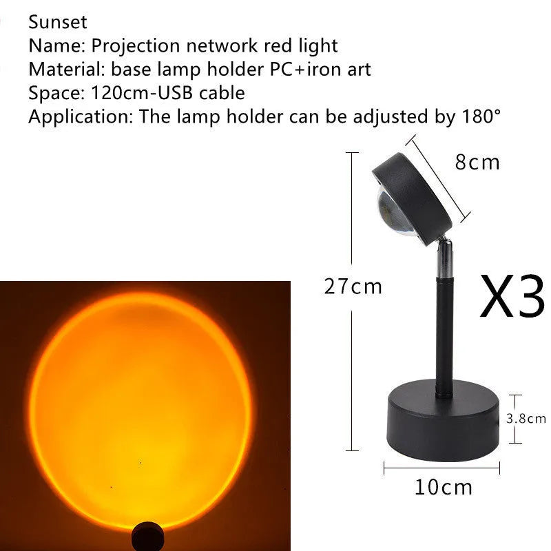 WiFi LED sunset projector light with 16 RGB colours, 360° rotation, glass lampshade, and touch switch on a table