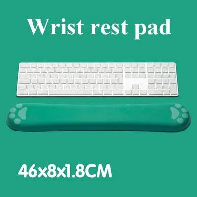 Cat's Claw cartoon design memory foam keyboard wrist rest pad in blue, shown on a desk.