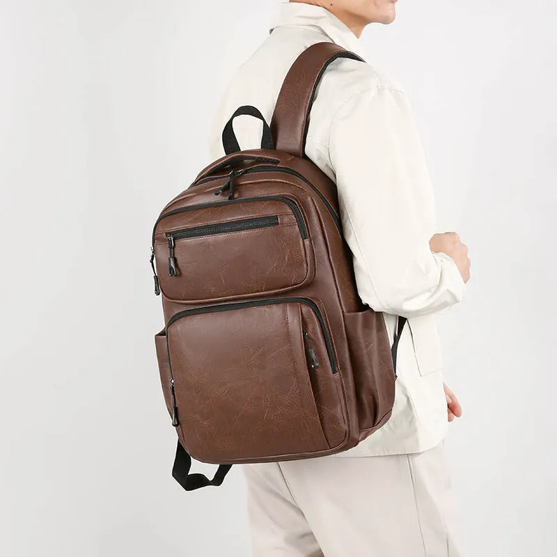 Large capacity men's business commute backpack in black, PU material, multi-space design, curved shoulder strap
