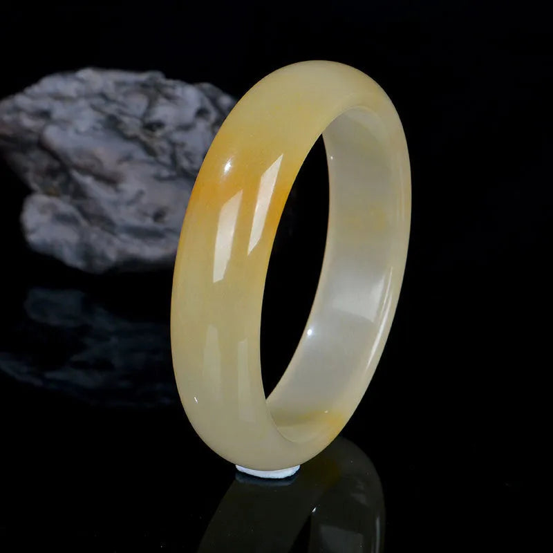 Natural light jade bracelet in traditional Chinese style with polished surface