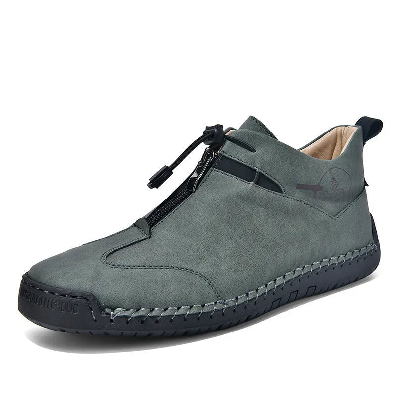 Casual men's leather travel shoes in black with rubber sole, mid heel, and round toe