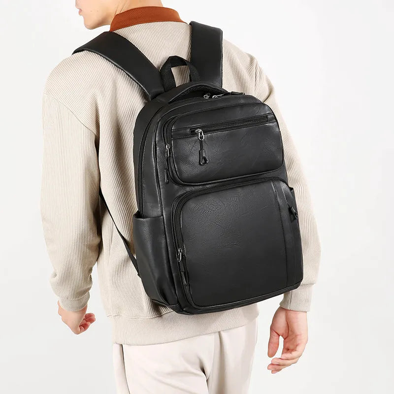 Large capacity men's business commute backpack in black, PU material, multi-space design, curved shoulder strap
