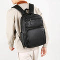 Large capacity men's business commute backpack in black, PU material, multi-space design, curved shoulder strap