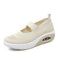 Women's beige slip-on mesh shoes with round toe and low heel on a white background