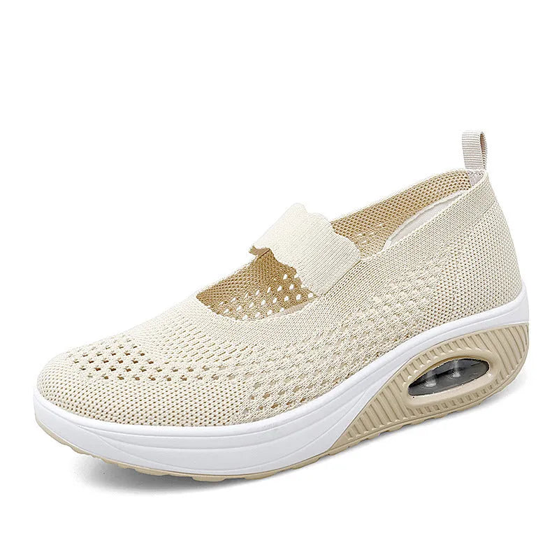 Women's beige slip-on mesh shoes with round toe and low heel on a white background