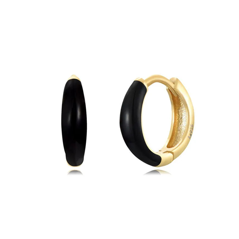 Oval-shaped curved drop earrings with colourful epoxy resin drip finish and silver metal pin.