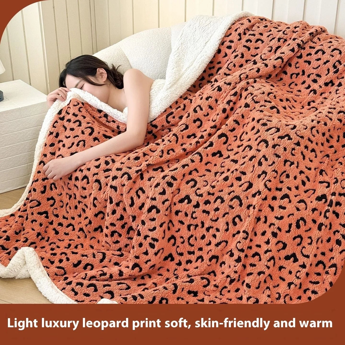 Double-layer taffeta blanket with woven leopard print pattern draped over sofa