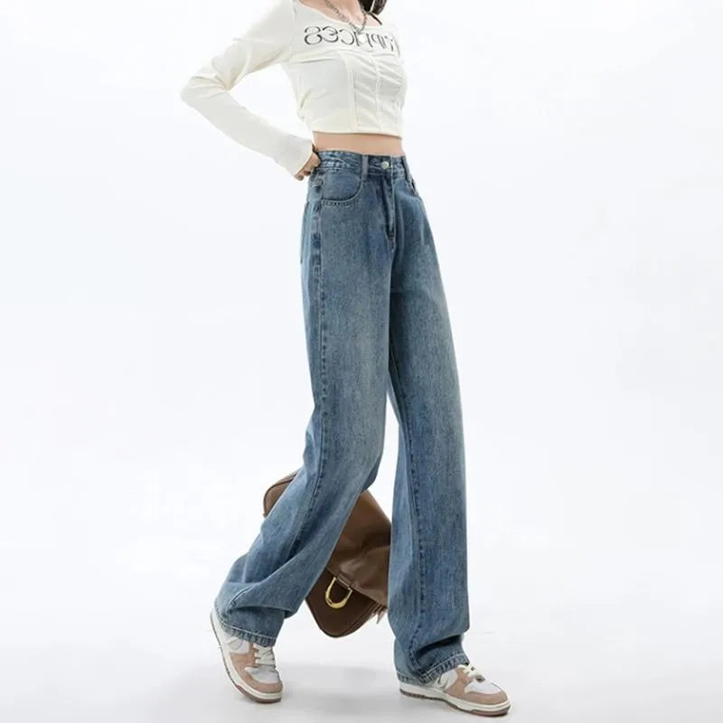 Women's retro blue high-waist wide leg jeans laid flat, showing the straight-leg trousers cut.
