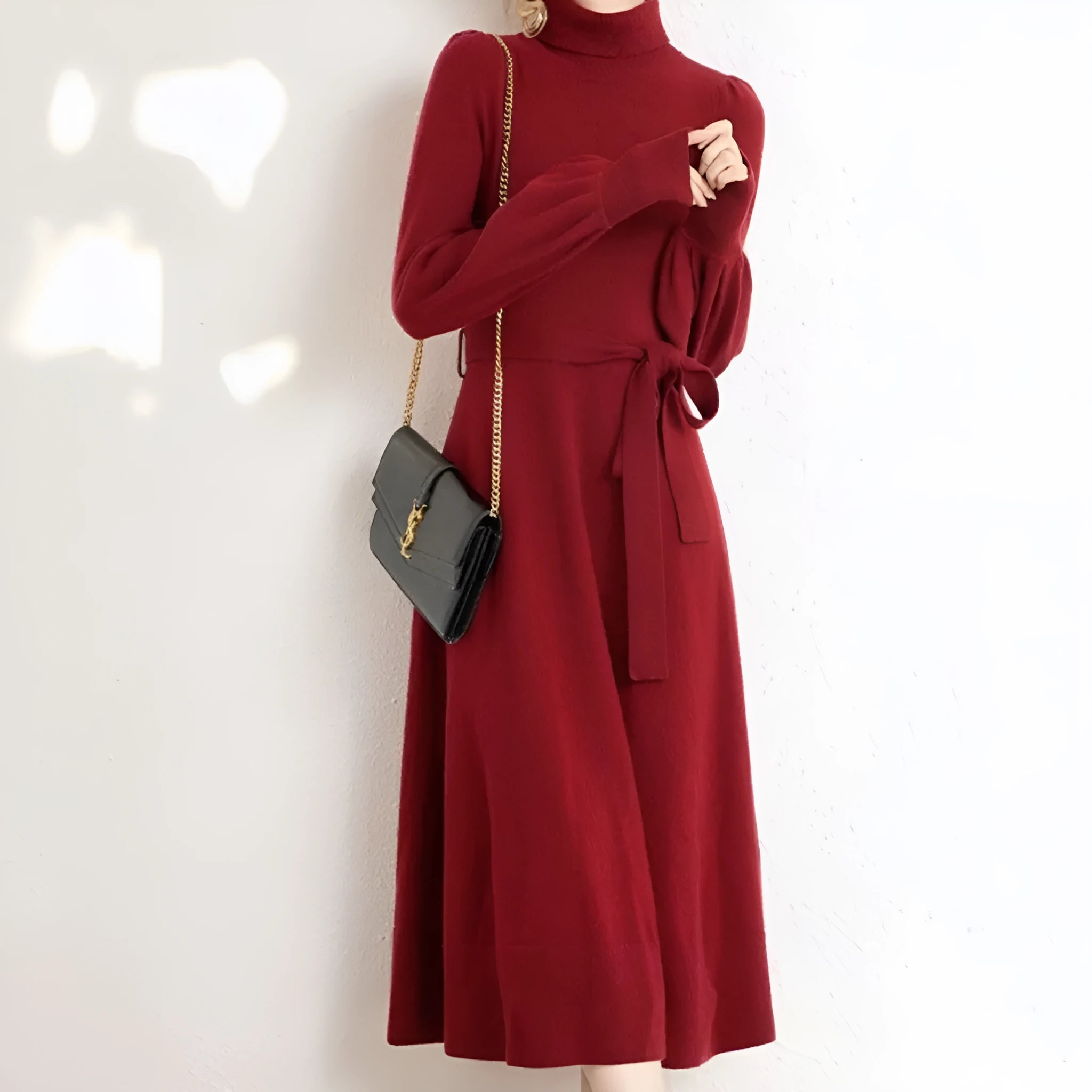 Rose red turtleneck knit dress with long sleeves, elastic waist, and loose mid-length sweater skirt hem.