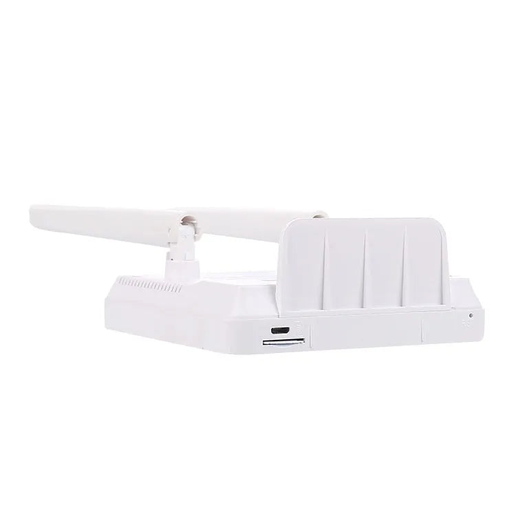 CPF903 LTE router unit with two attached external antennas, USB cable, and power adapter on a desk.