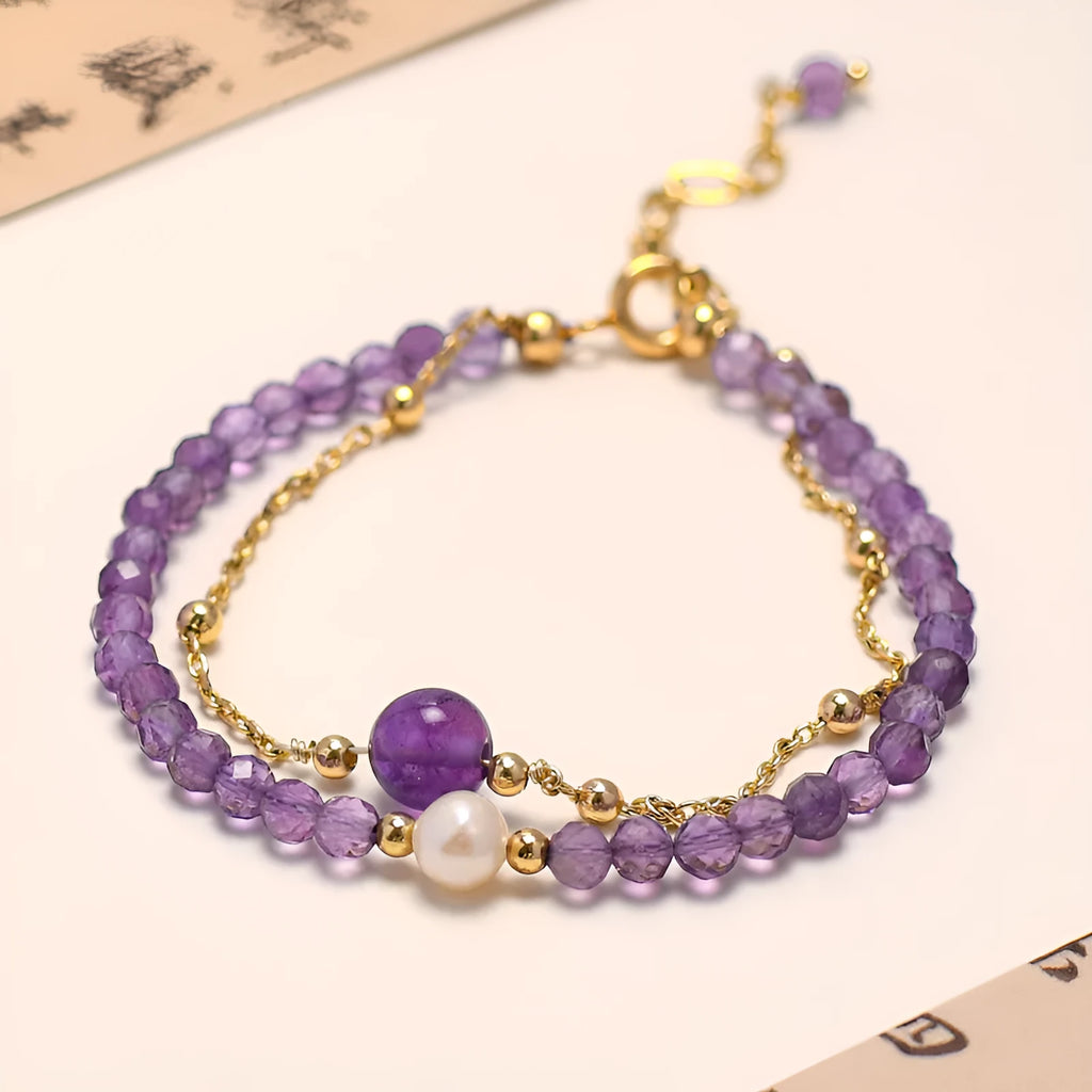 Close-up of an amethyst coloured Chinese style bracelet for women, featuring electroplated diamond-shaped crystals.