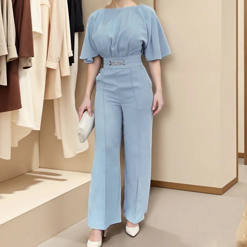 Blue men's two-piece polyester suit set with long-sleeved jacket and trousers on a hanger.