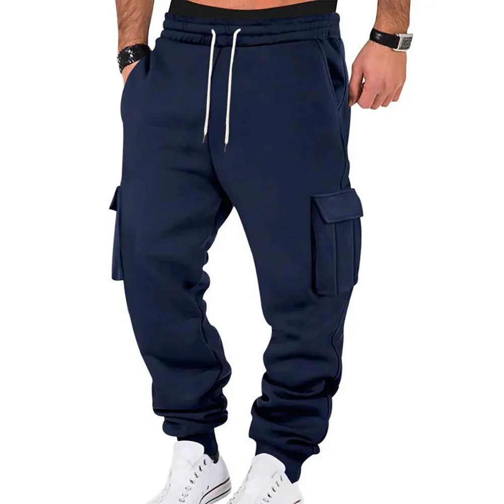 Men's solid colour casual multi-pocket drawstring sports pants in black, featuring polyester fabric and mid-waist design