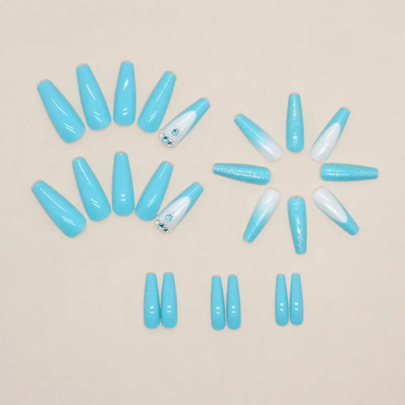 Solid blue long ballet false nails with diamond glitter design and included adhesive glue.