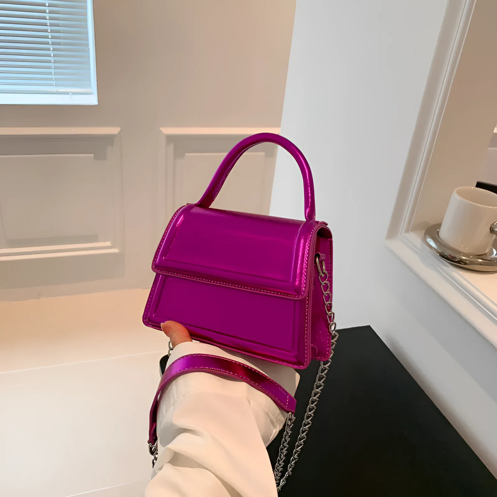 Retro square crossbody bag in PU leather with sewing line details, shown in a selection of colours.