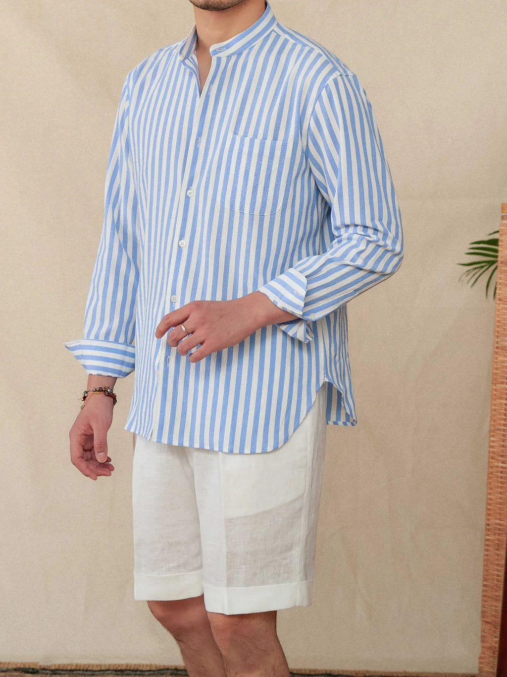 Blue and white seersucker striped men's shirt with baseball collar and loose lapel design
