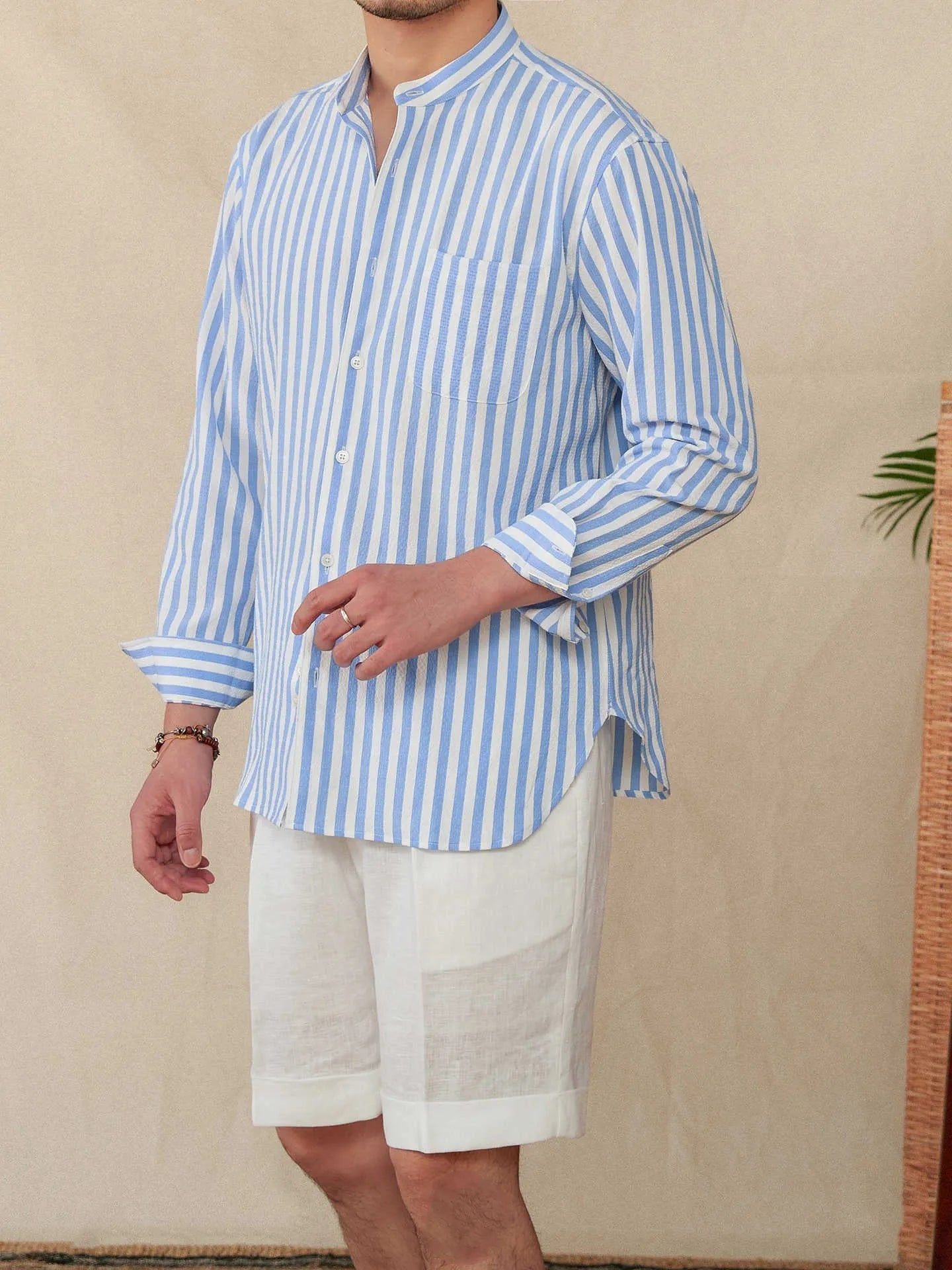 Blue and white seersucker striped men's shirt with baseball collar and loose lapel design