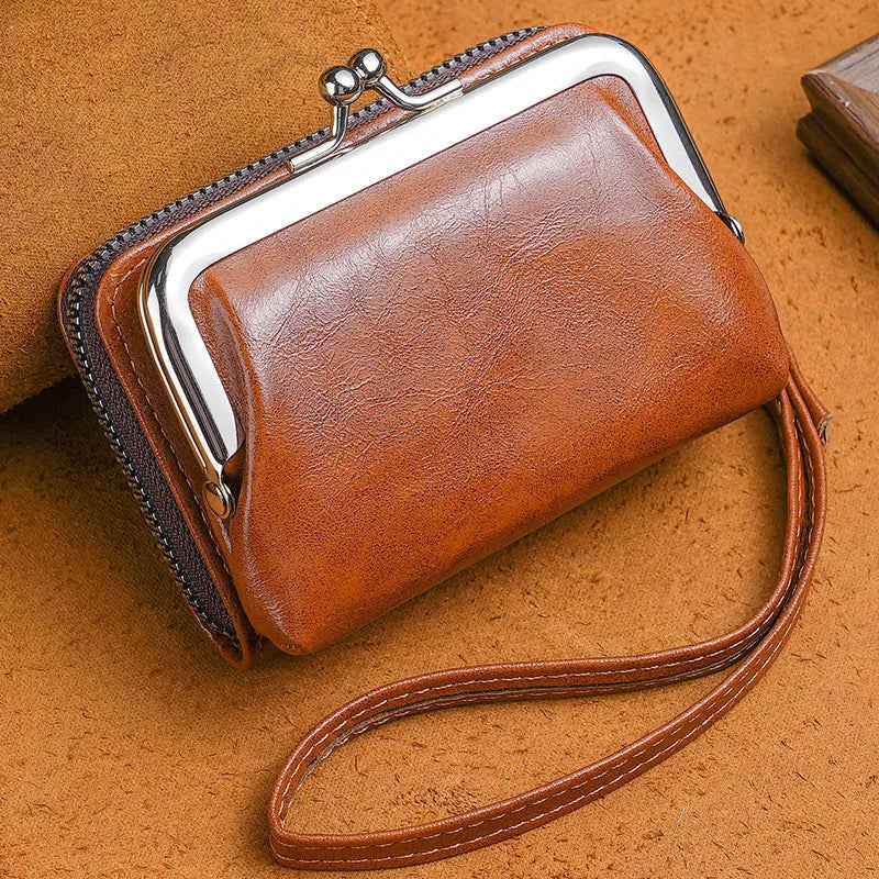 Ladies' leather-look coin purse with a 4-inch metal clip and zip closure in five colour options.