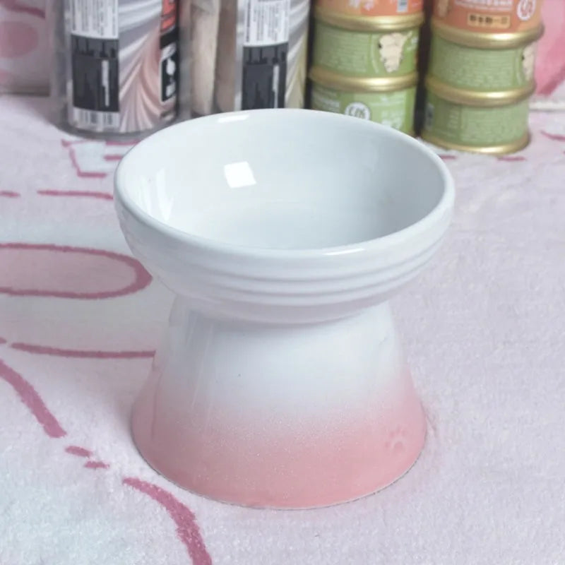 Black ceramic pet bowl with a high foot and neck protector to prevent tipping, shown with flat and slanted rim options.