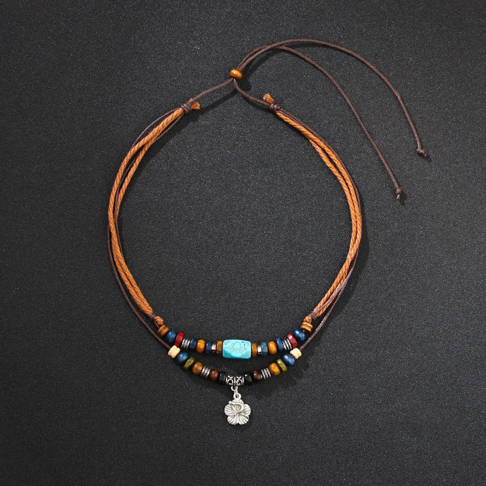 Wooden bead necklace with alloy floral pendant and turquoise wax rope in retro design
