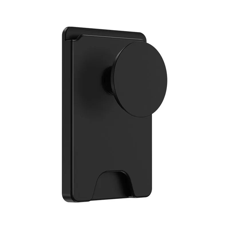 Minimalist black magnetic suction phone holder for iPhone on a desk.