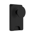 Minimalist black magnetic suction phone holder for iPhone on a desk.