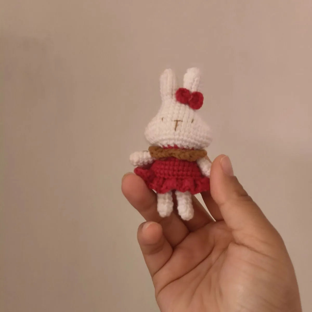 Hand-crocheted wool rabbit key chain pendant in amigurumi style