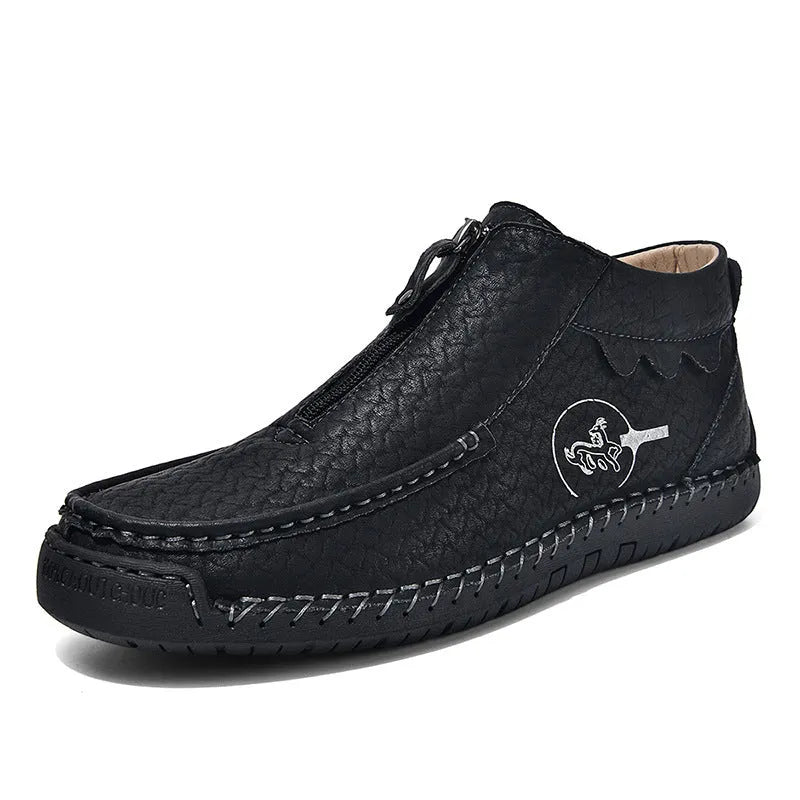 Men's black slip-on loafers with round toe and visible stitching on a rubber sole.