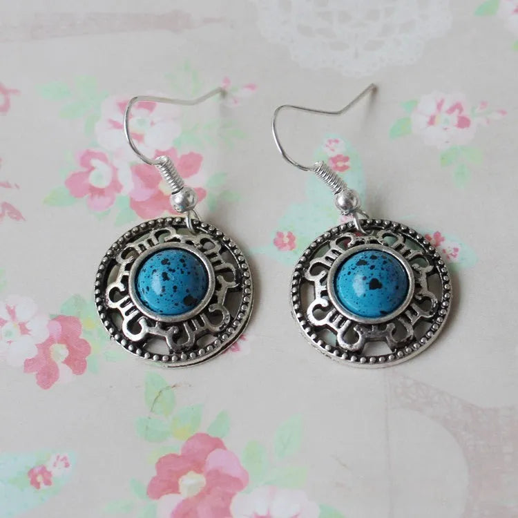 Miao silver retro turquoise flower disk earrings with geometric ethnic design in red, blue, or black colours