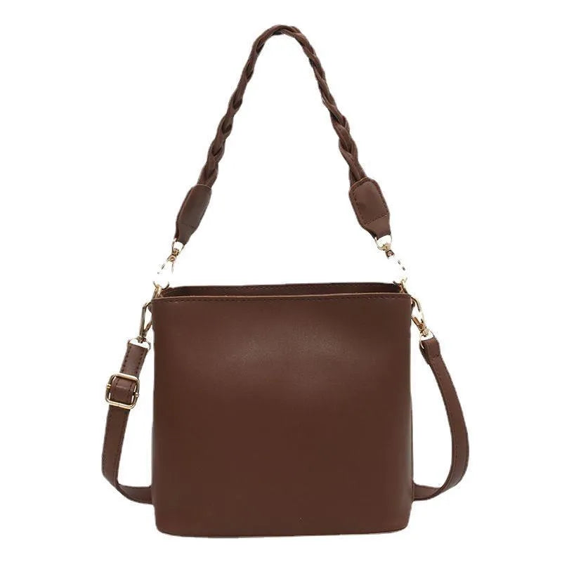 Retro woven PU leather bucket bag in khaki colour with crossbody strap.