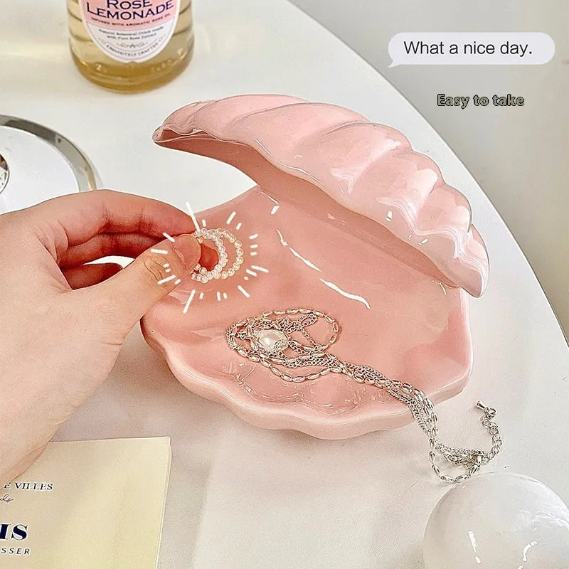 White porcelain storage tray holding a small night light, in yellow, pink, or white colour.