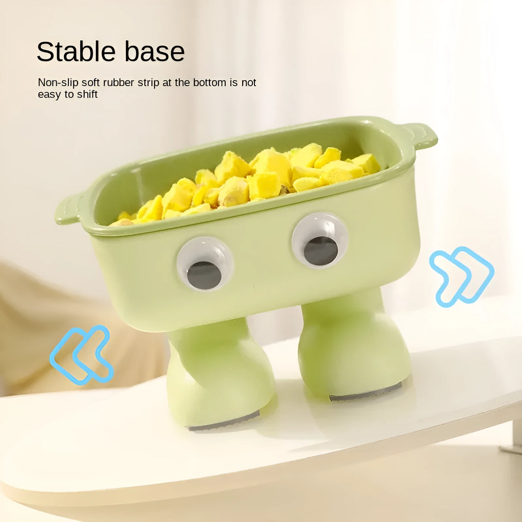Green robot-shaped elevated cat bowl with tilted design and removable inner bowl on anti-slip base