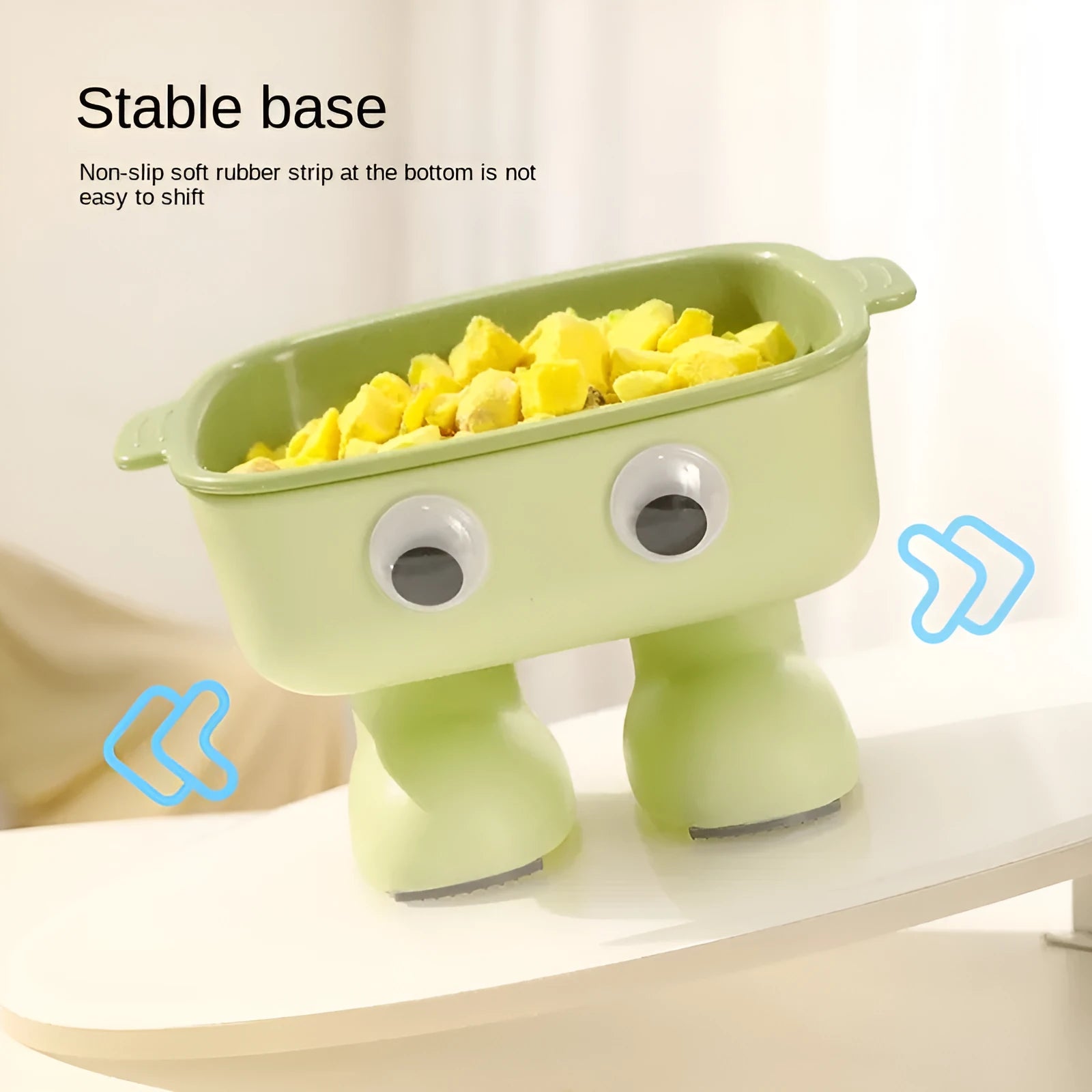 Green robot-shaped elevated cat bowl with tilted design and removable inner bowl on anti-slip base