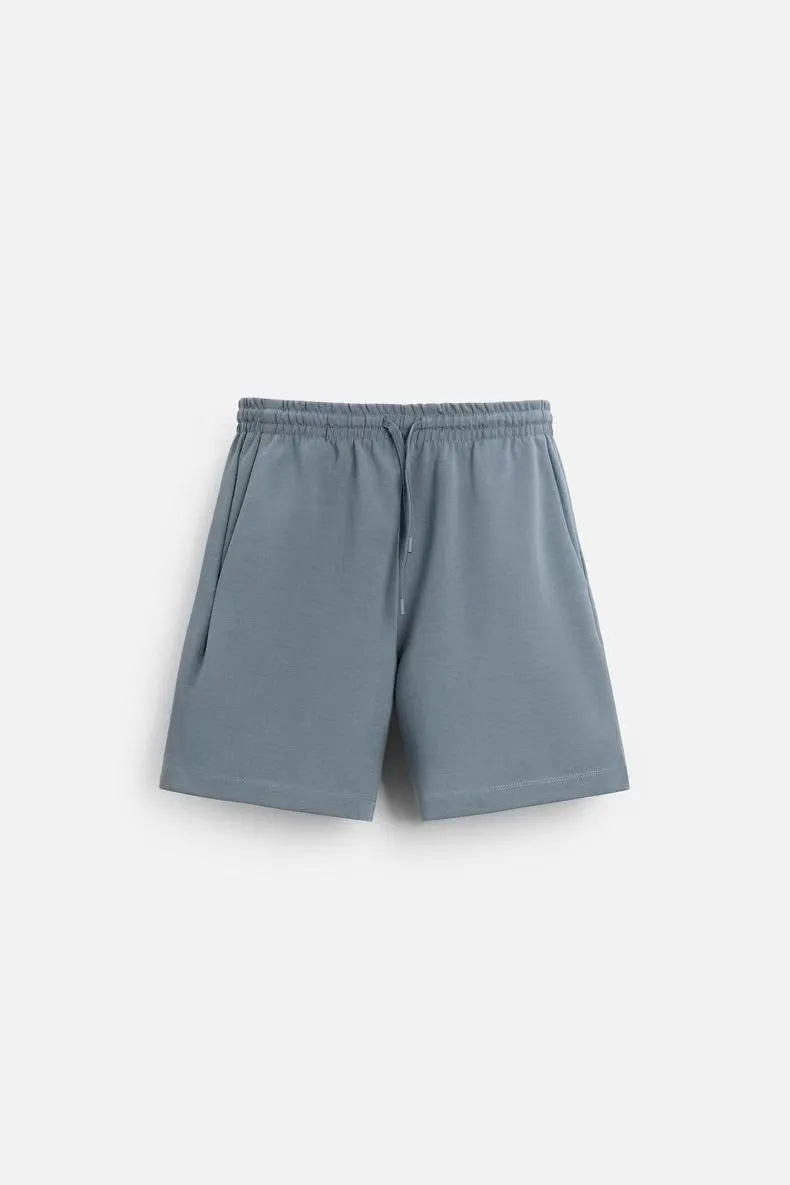 Loose double-sided cloth texture short sleeve top and matching shorts set on a hanger.