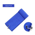 Waffle weave golf ball cleaning towel in blue, shown next to a golf ball.