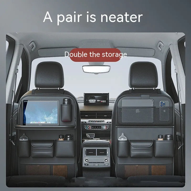Leather car seat storage bag with carrying handle shown in black, hanging over a car seat.