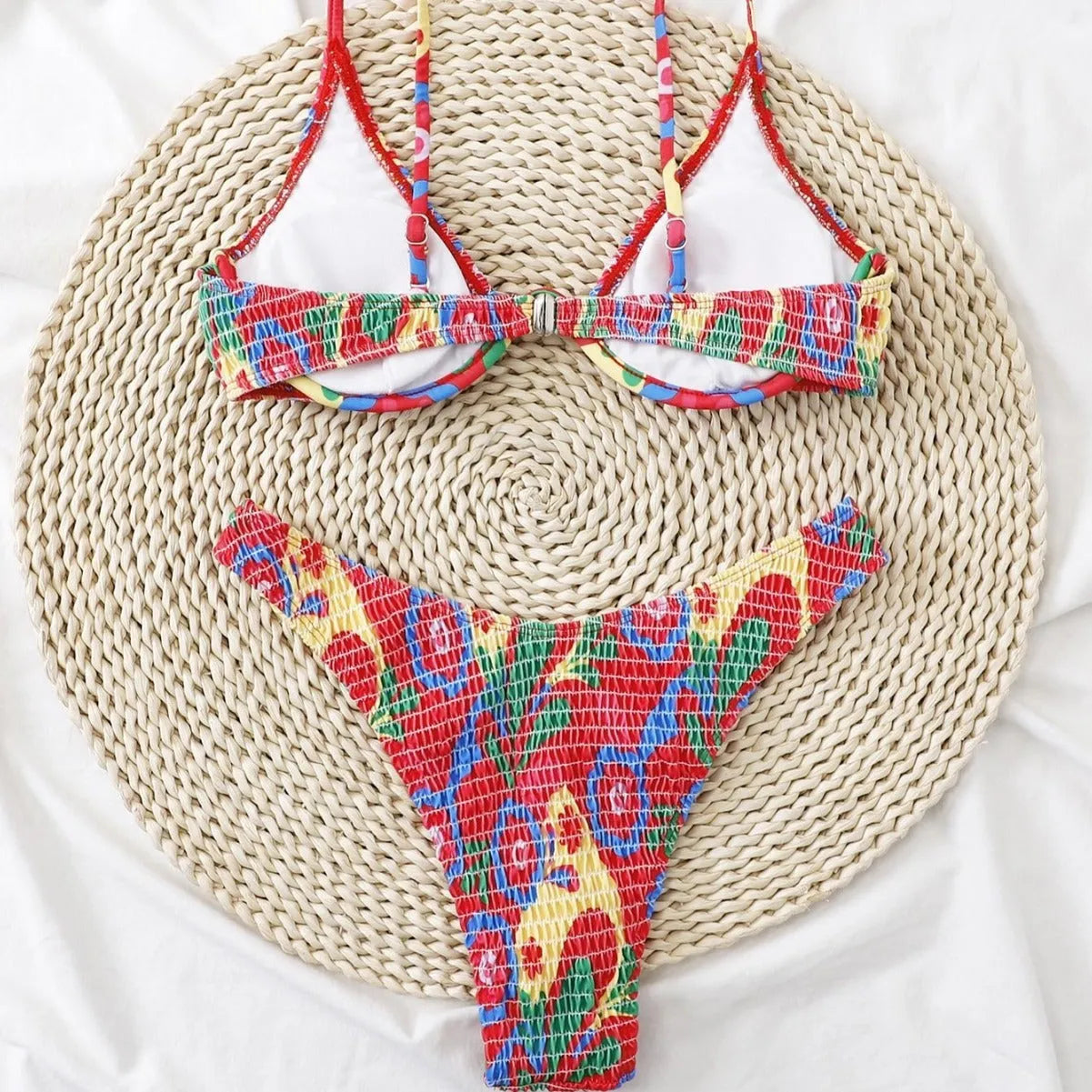 Red floral print women's two-piece underwire bikini set on a mannequin.