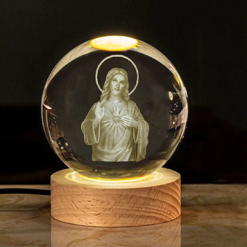 White crystal ball desk ornament with wood base and religious design inside