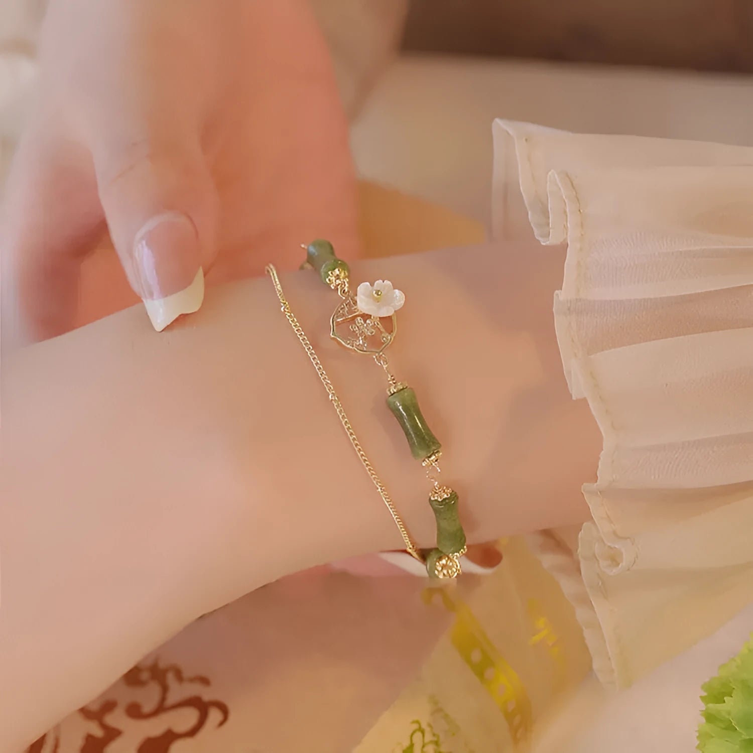 Natural olivine bracelet with Chinese double layer design featuring twin Bells of Ireland elements