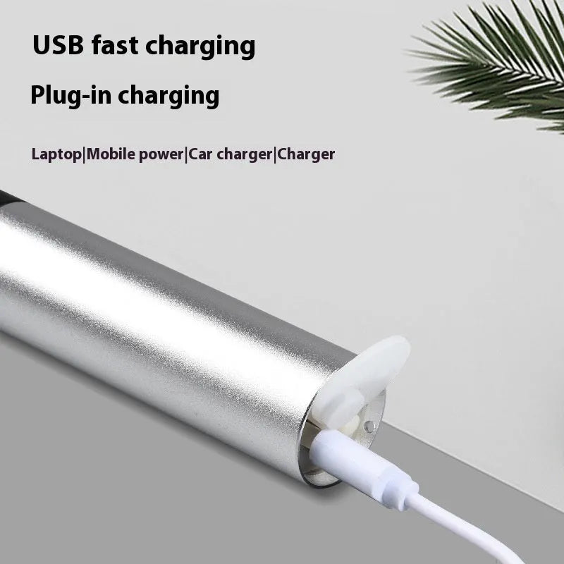 Handheld black aluminium red light mosquito repellent lamp with USB charging cable.