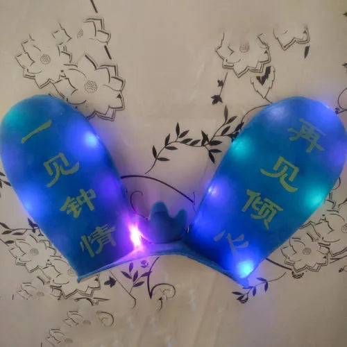 Rabbit Glow helmet decoration with Velcro bottom on a ski helmet, shown in blue LED style.