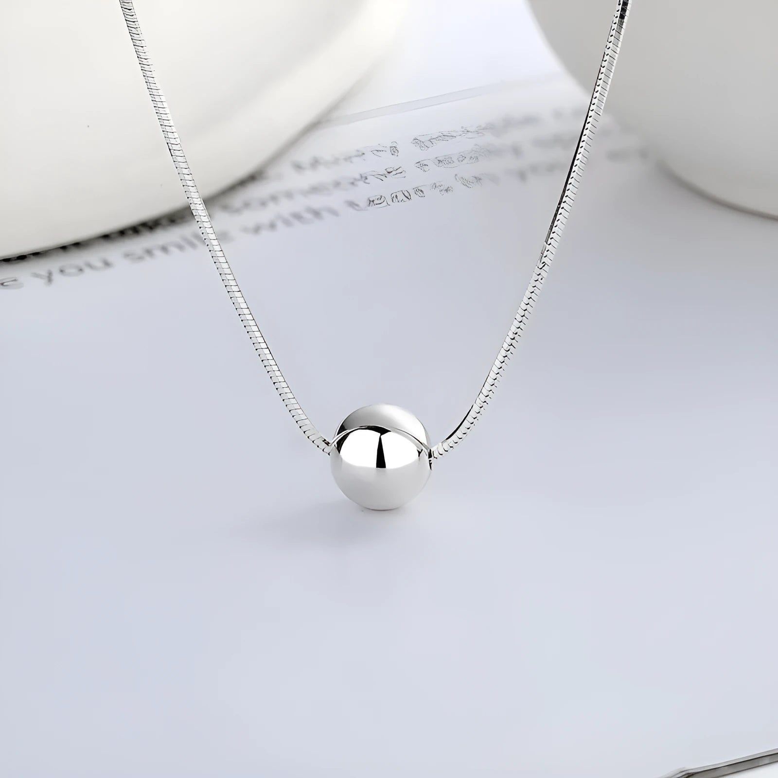 Small spherical pendant silver clavicle chain necklace with round elements and 925 sterling silver construction