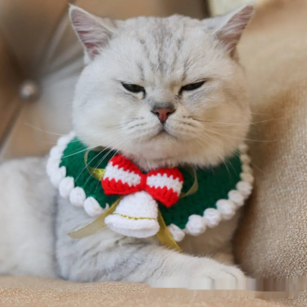 Knitted wool Christmas scarf for pets featuring festive patterns like striped Santa and elk, shown attached to a dog collar.