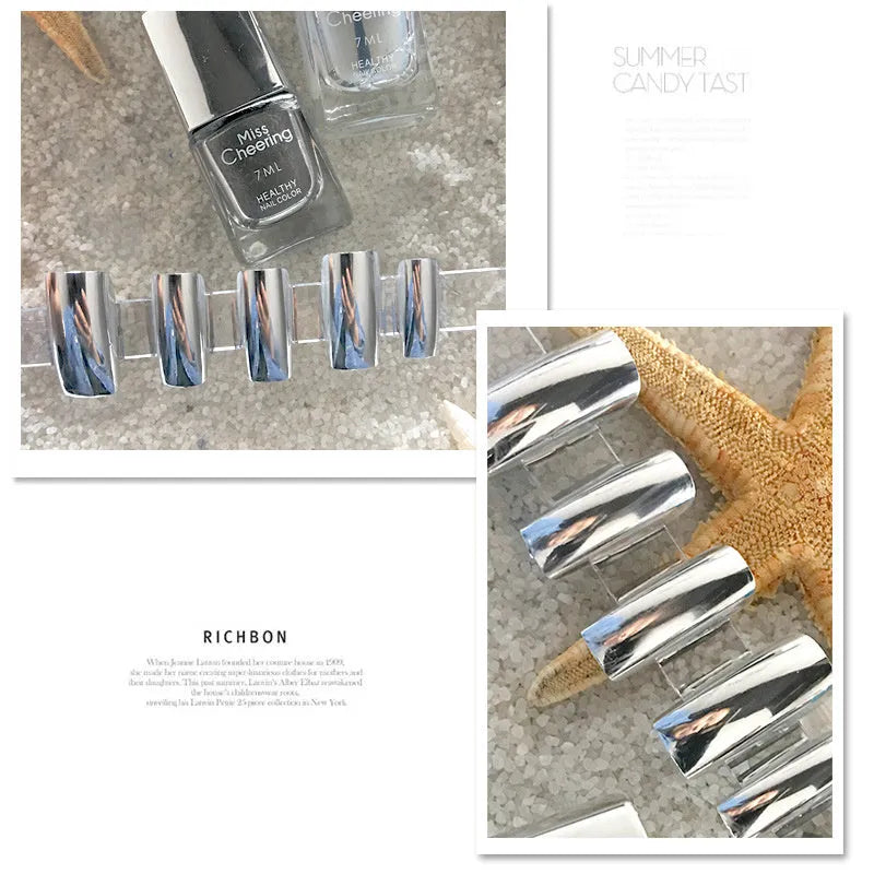Bottle of mirror silver nail polish with brush and stainless-steel ball for mixing