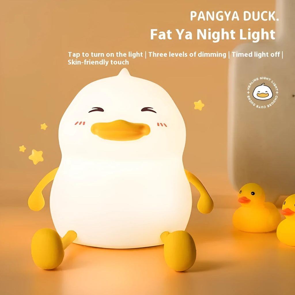 Chubby Night Light on a desk showing its compact size and silicone phone holder feature.