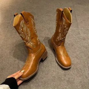 Brown women's mid-calf Martin boots with embroidery detailing and waterproof platform