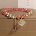 Women's strawberry quartz and white agate crystal bracelet with auspicious cloud design