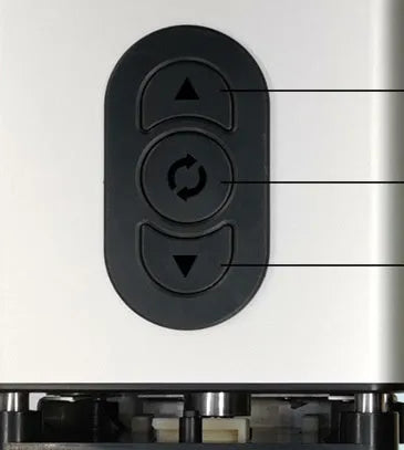 Black electric french fry cutter machine with stainless steel blades on a kitchen countertop.