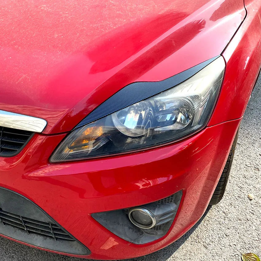 Ford Focus headlight sticker in carbon fibre pattern and piano black finishes for exterior decorative modification